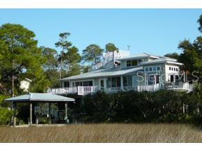 16871 County Road Cedar Key, FL 32625 - Photo 1 of 1 a front view of house with a garden