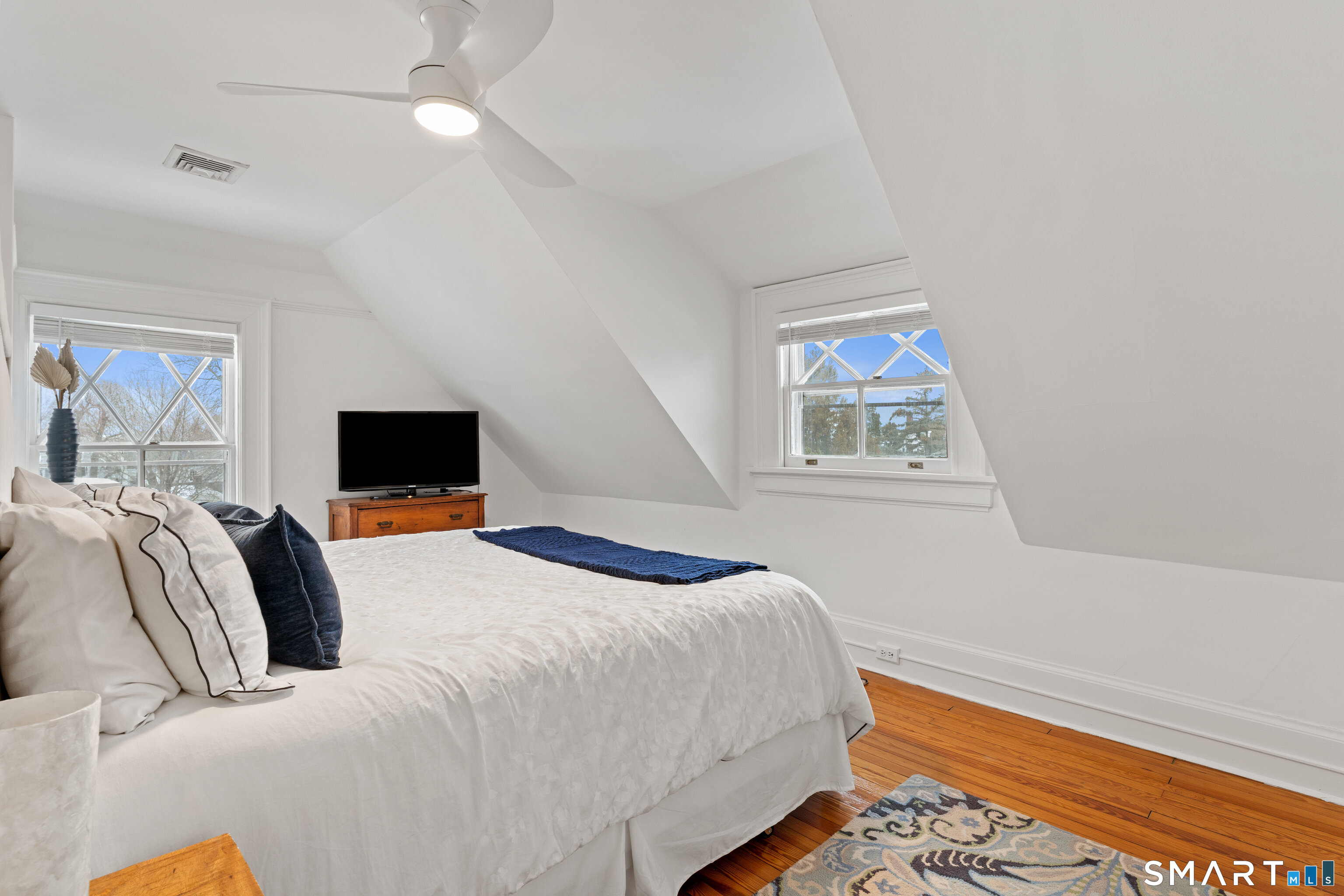 40 Rogers Road Stamford, CT 06902 - Photo 31 of 40 a bedroom with a bed and a television