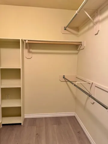 a view of an empty walk in closet
