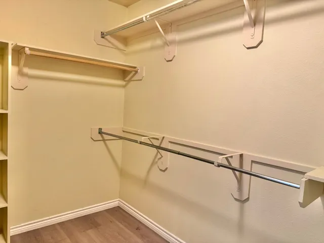 a view of a room with racks on the wall