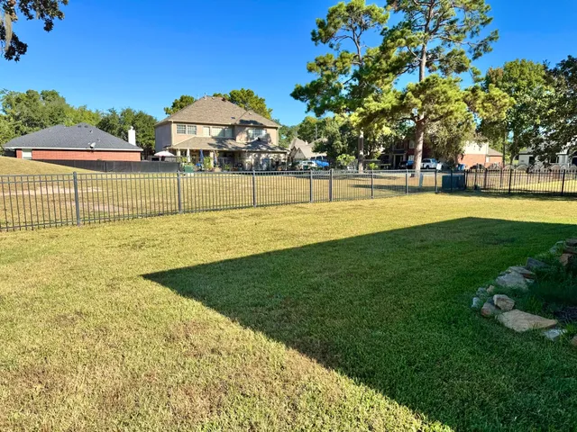 a view of a playground with basketball court
