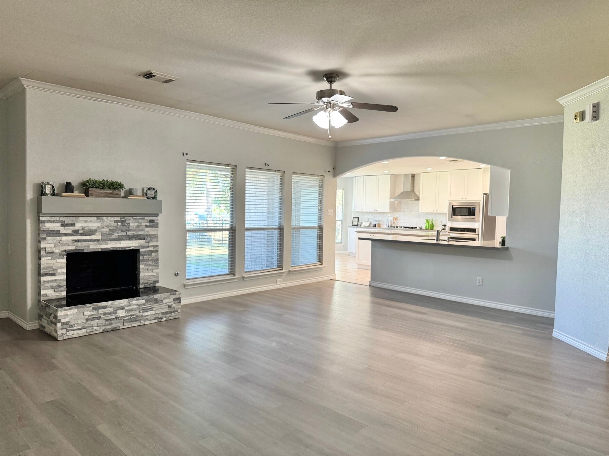 8603 Malardcrest Drive Humble, TX 77346 - Photo 9 of 21 a view of an empty room with a fireplace and a window