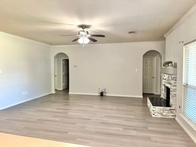 a view of an empty room with a window