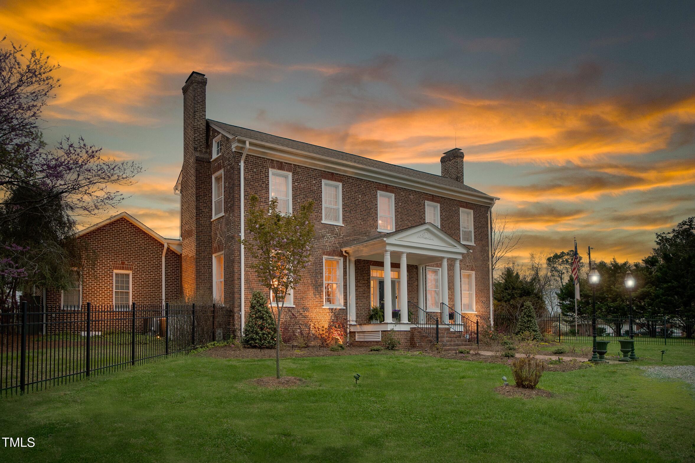 3542 Bason Road Mebane, NC 27302 - Photo 1 of 39 a front view of a house with a garden