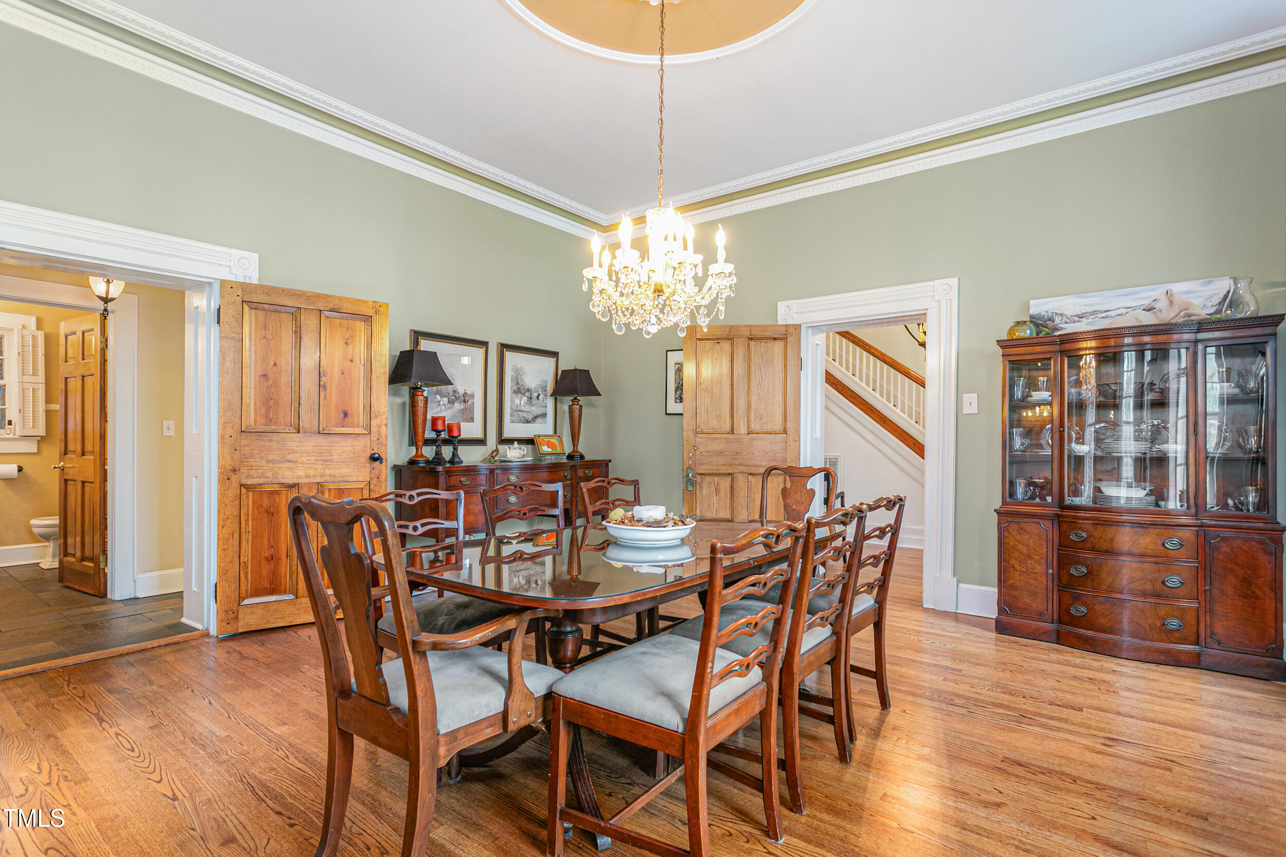 3542 Bason Road Mebane, NC 27302 - Photo 11 of 39 a view of a dining room with furniture window and wooden floor