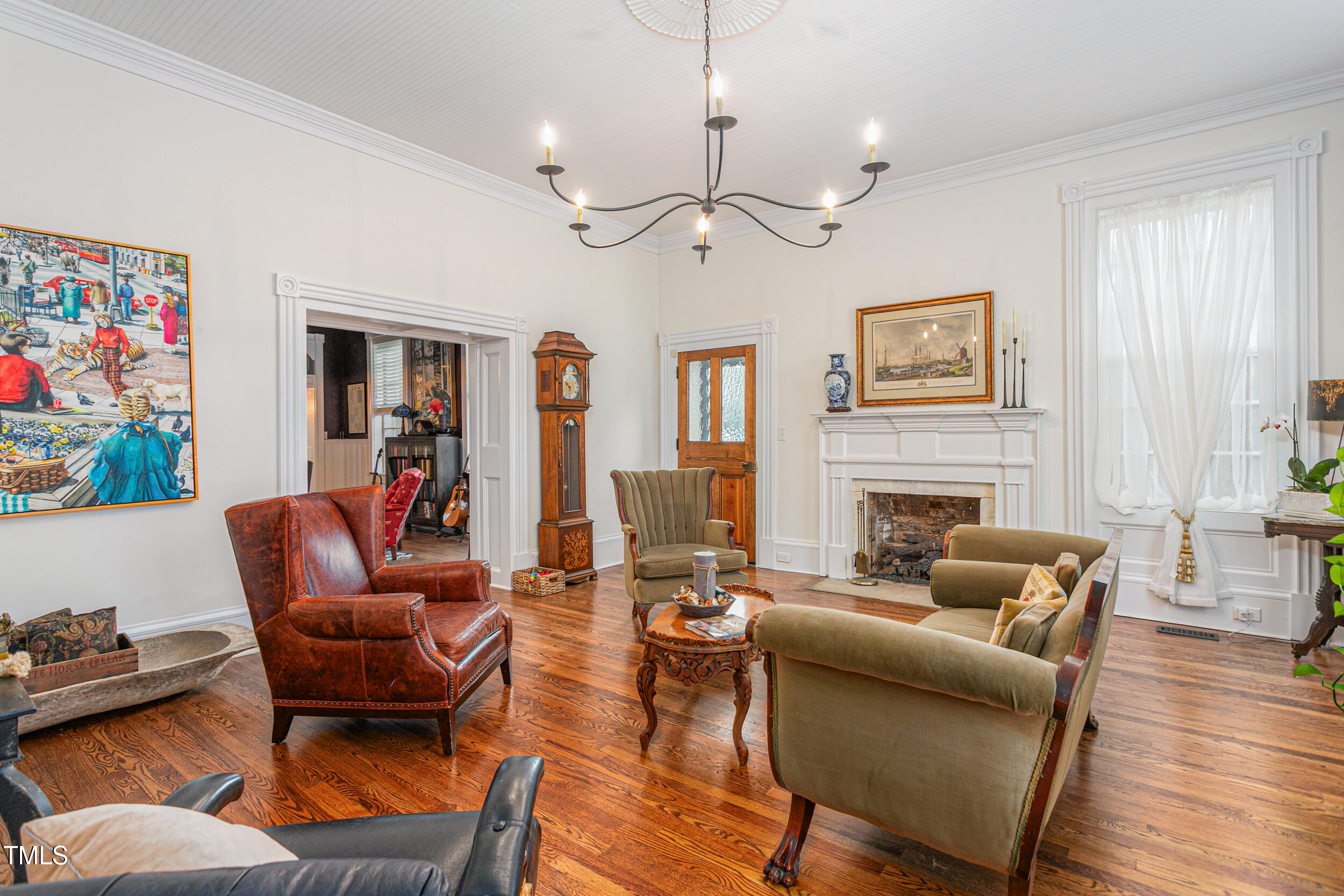 3542 Bason Road Mebane, NC 27302 - Photo 12 of 39 a living room with furniture a fireplace and a window
