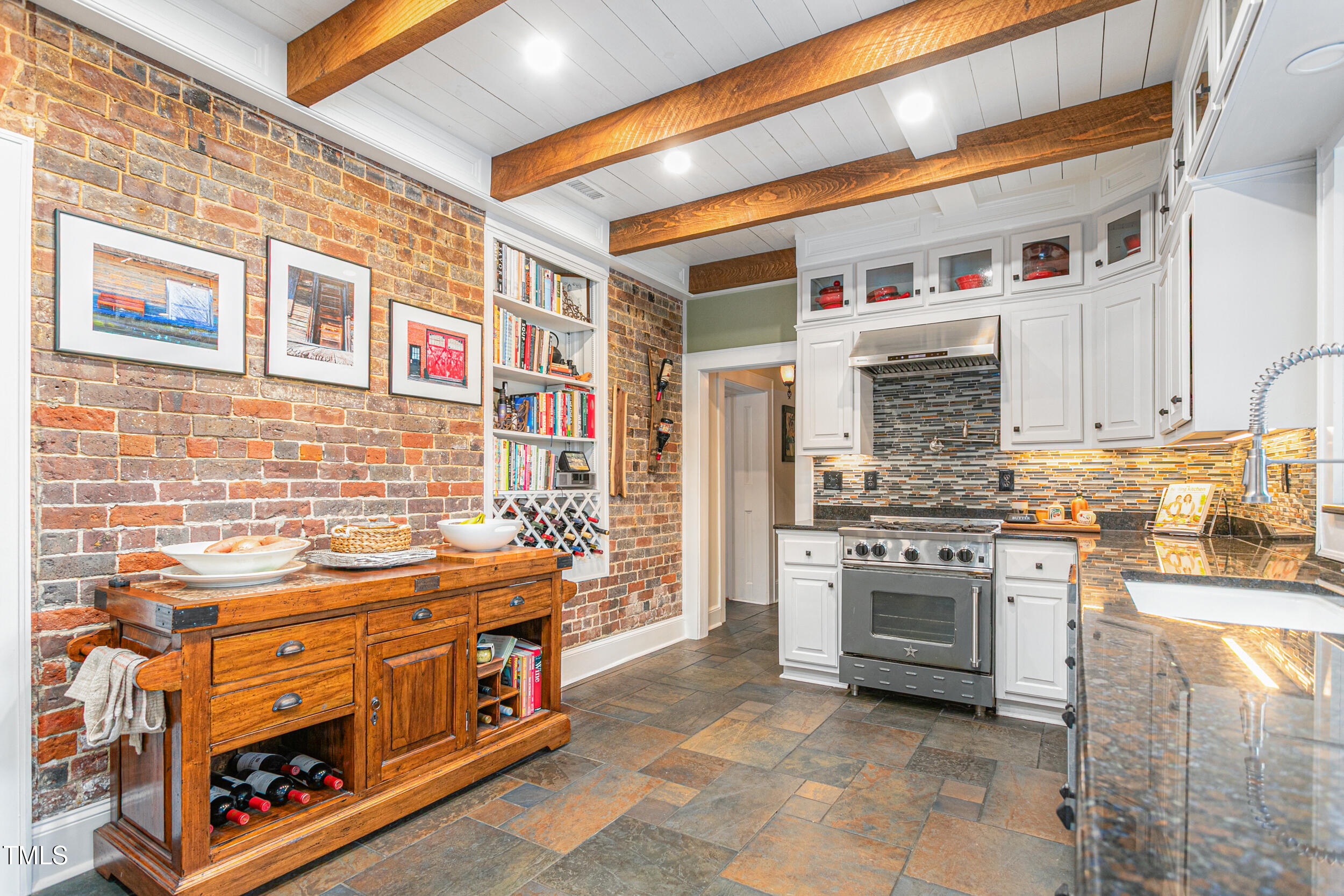 3542 Bason Road Mebane, NC 27302 - Photo 14 of 39 a kitchen with stainless steel appliances granite countertop a stove and a cabinets