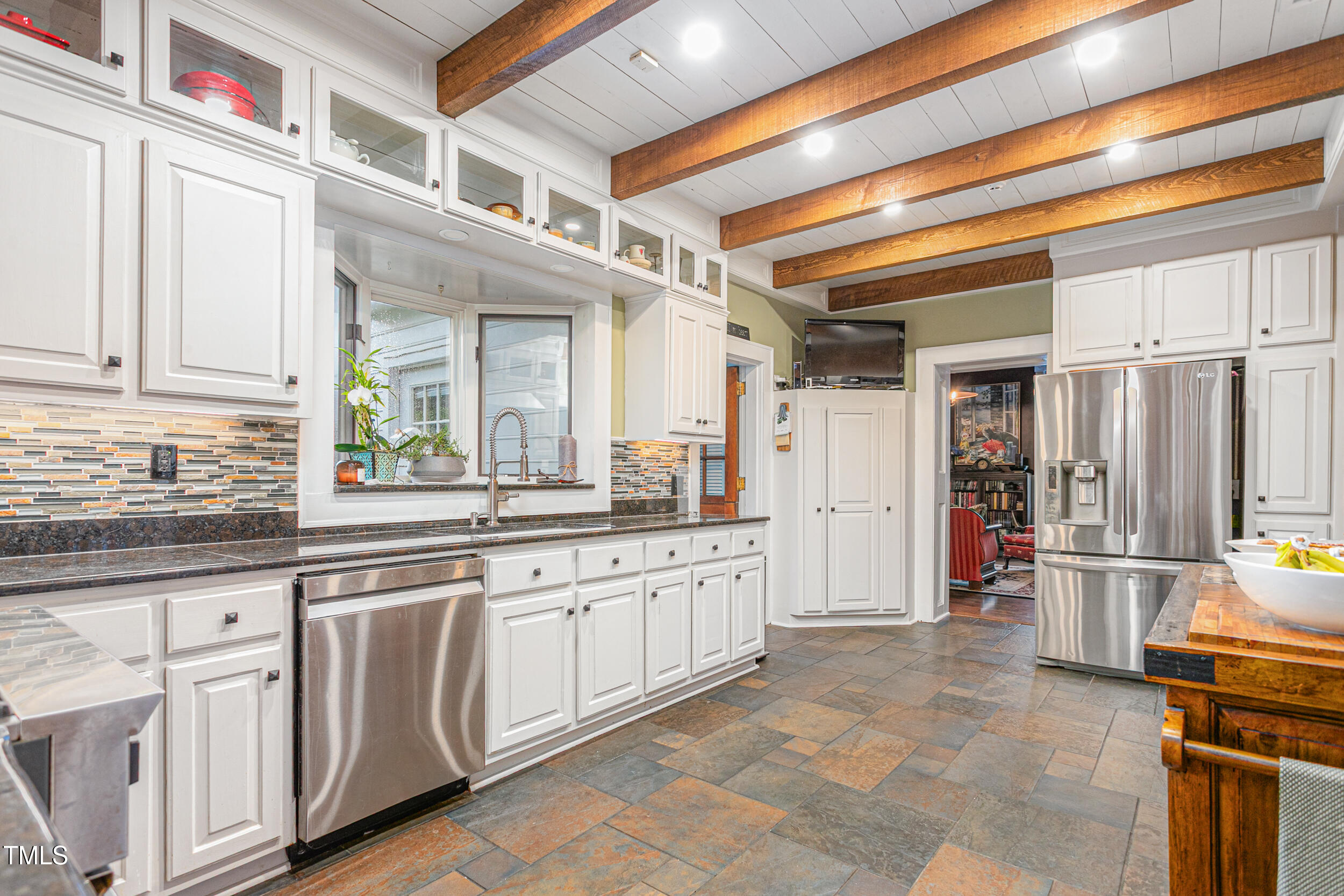 3542 Bason Road Mebane, NC 27302 - Photo 15 of 39 a kitchen with cabinets and chairs