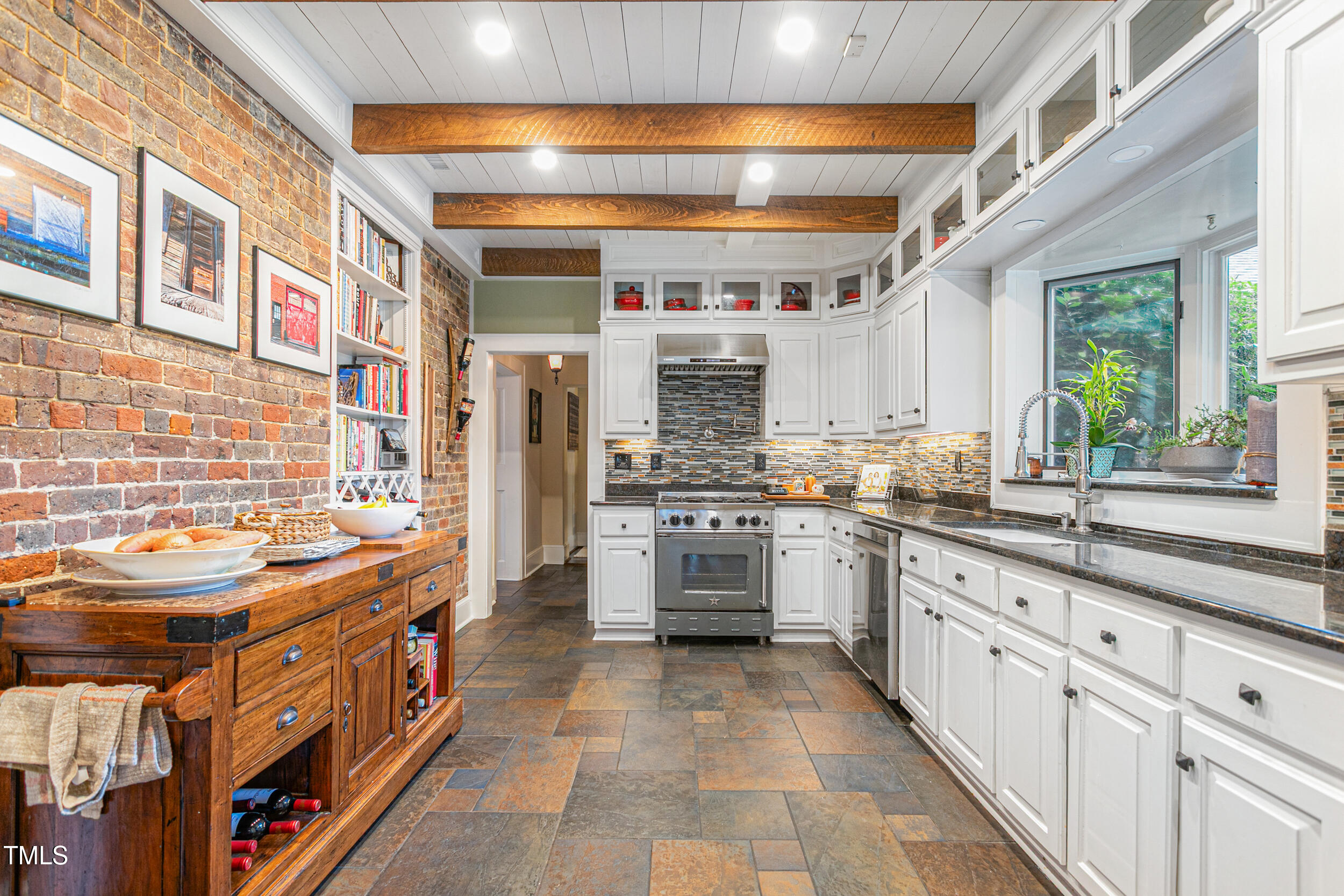 3542 Bason Road Mebane, NC 27302 - Photo 16 of 39 a kitchen with stainless steel appliances granite countertop a sink and cabinets