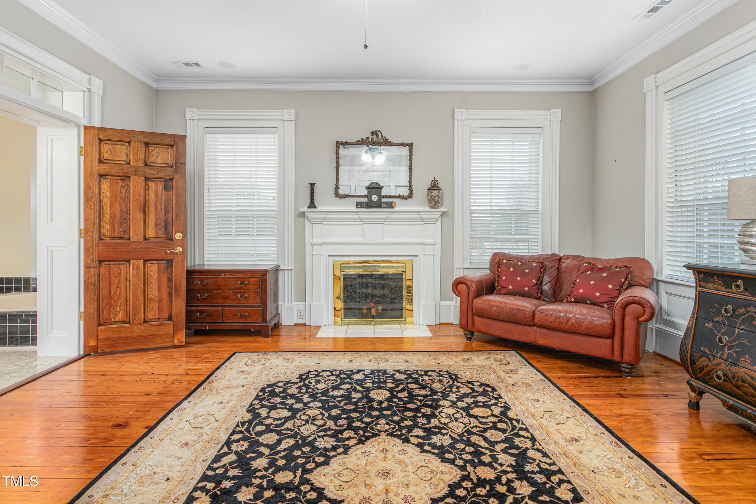 3542 Bason Road Mebane, NC 27302 - Photo 25 of 39 a living room with furniture and a fireplace