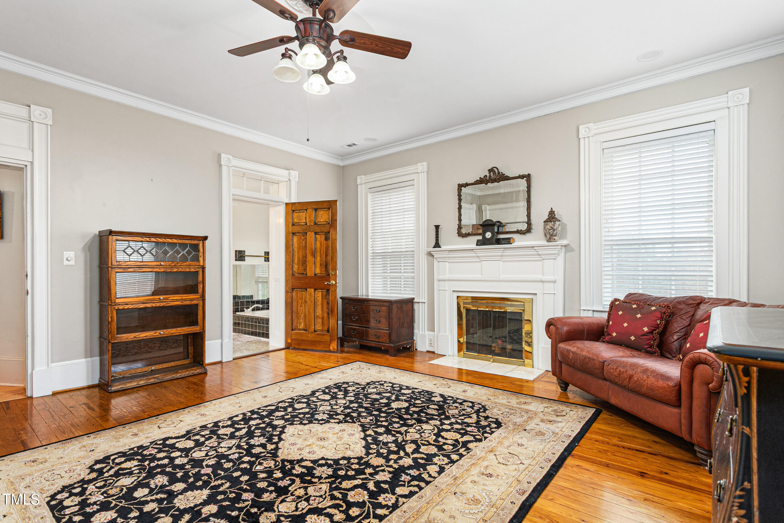 3542 Bason Road Mebane, NC 27302 - Photo 29 of 39 a living room with furniture and a fireplace