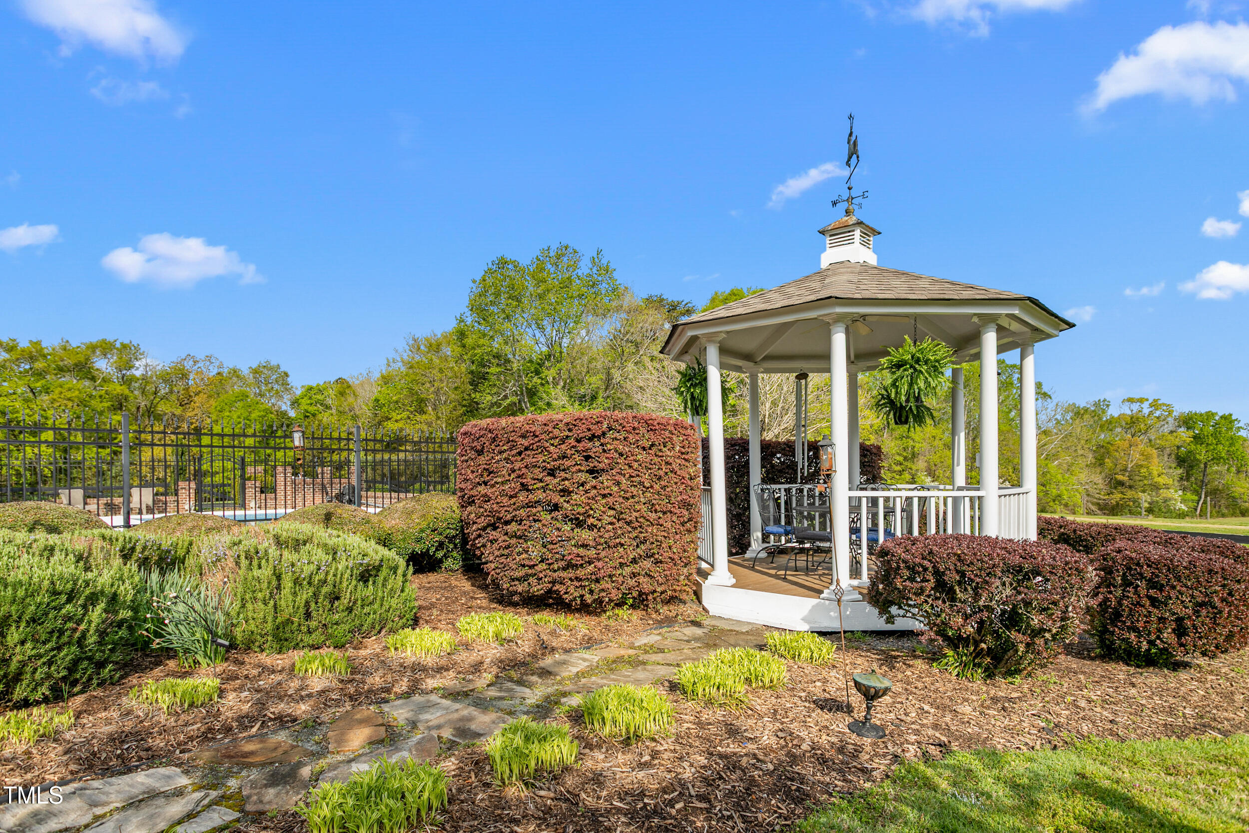 3542 Bason Road Mebane, NC 27302 - Photo 37 of 39 a front view of a house with garden