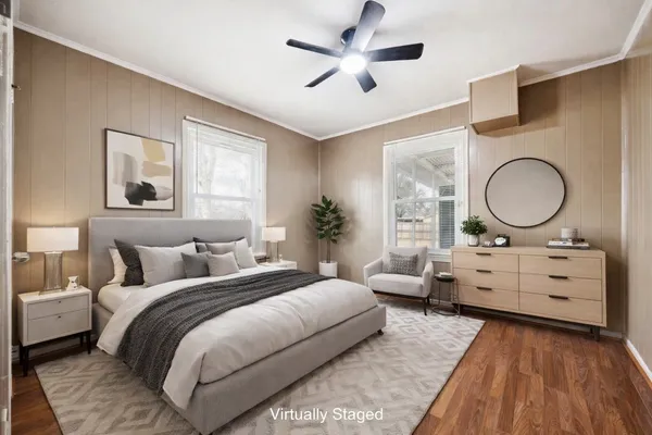 a bedroom with a large bed and window