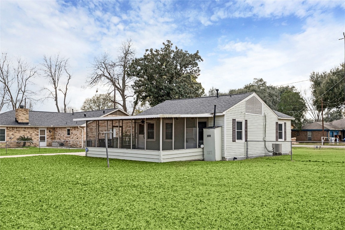 12537 Terrance Street Houston, TX 77085 - Photo 21 of 27 Picture yourself relaxing in this screened porch and a spacious, well-maintained lawn.