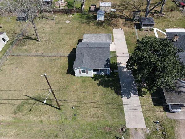 an aerial view of residential houses with outdoor space