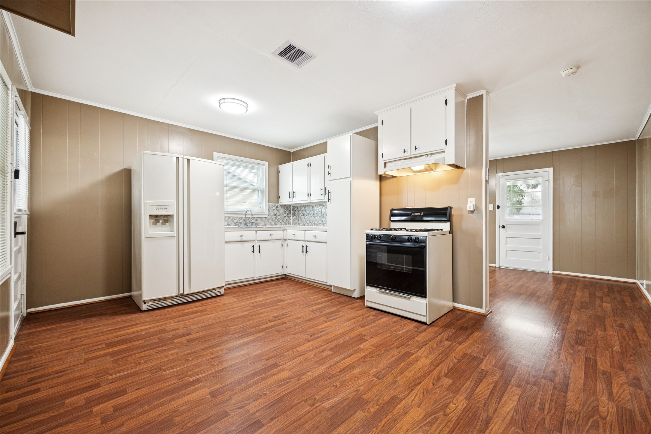 12537 Terrance Street Houston, TX 77085 - Photo 9 of 27 a kitchen with stainless steel appliances a refrigerator and a stove top oven