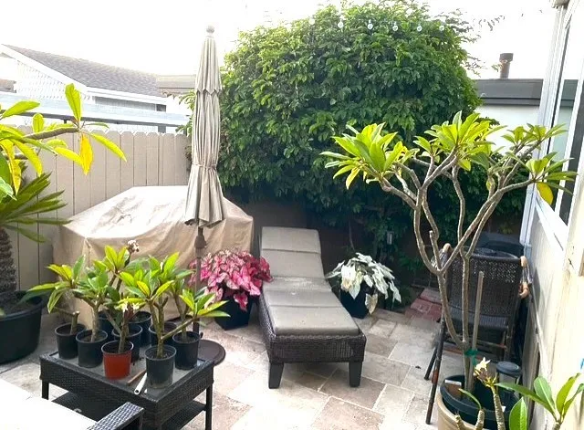 a outdoor living space with furniture and flowers
