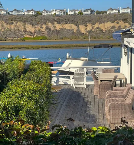 an aerial view of a houses with a lake view