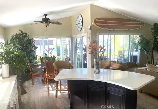 a kitchen with a sink cabinets appliances and a window