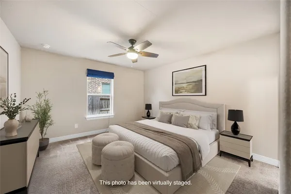 a living room with furniture a rug and a potted plant