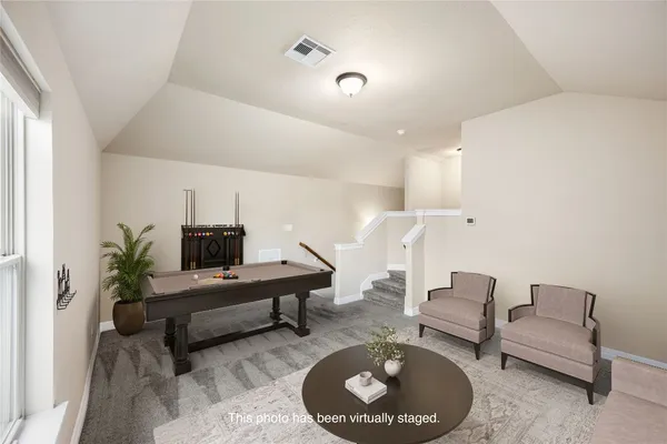 a view of a big house with a big yard and large trees