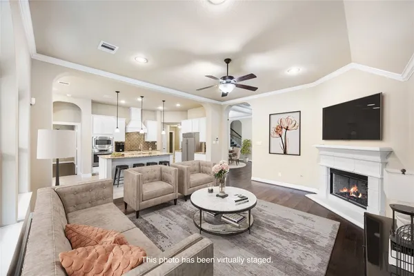 a kitchen with a stove a kitchen island a sink dishwasher a kitchen island with wooden cabinets and floor