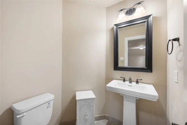 a front view of a house with a garden and yard