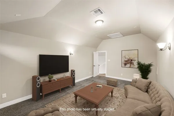 an outdoor space with lounge chair and purple flowers