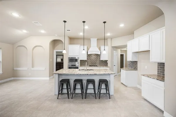 a view of a bathroom with tub and window