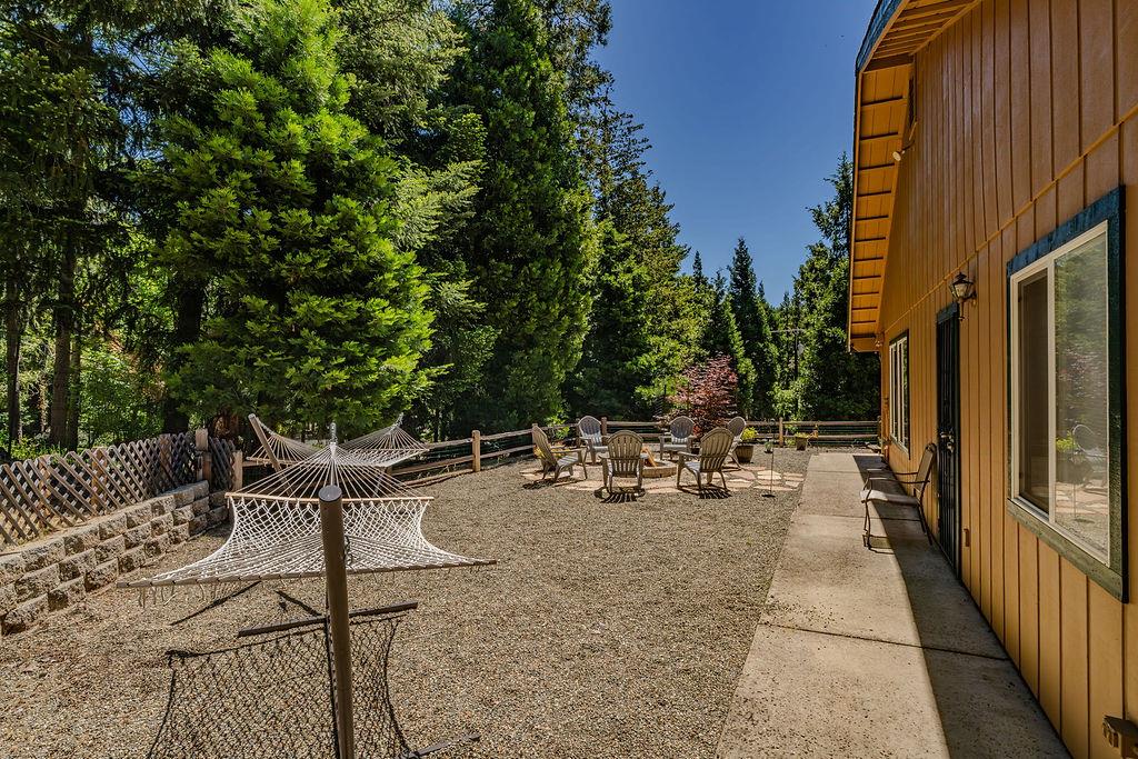 26845 Spring Court Pioneer, CA 95666 - Photo 60 of 89 a view of backyard with a table and chairs with wooden fence