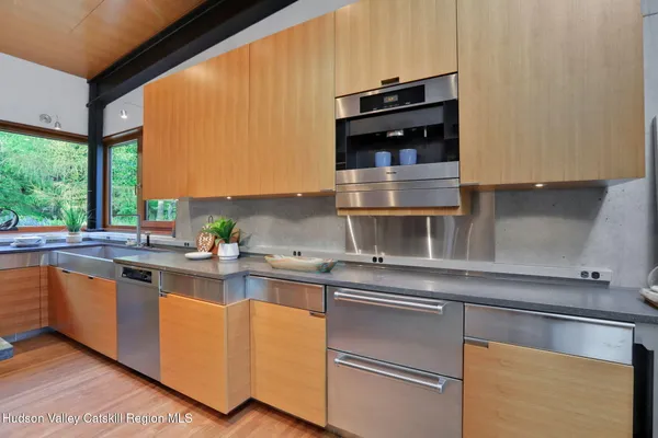 a view of a dining room with furniture wooden floor and chandelier