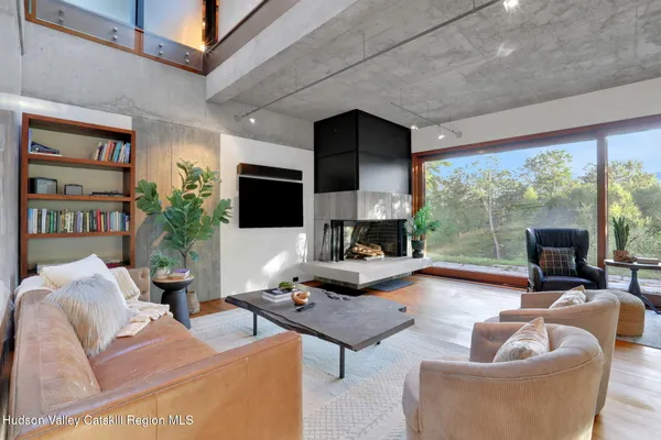 a living room with furniture and a lamp