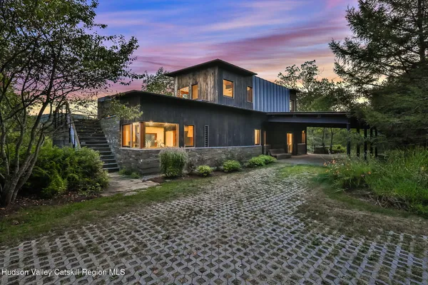 a bathroom with a sink toilet and mirror