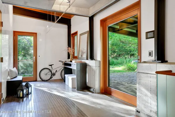 a view of hallway with wooden floor
