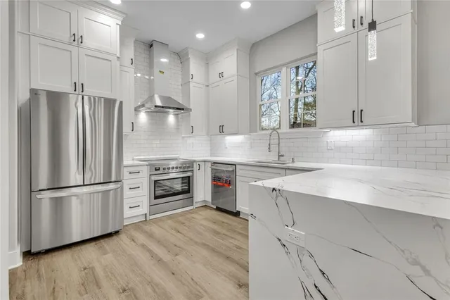 a kitchen with a refrigerator and a sink