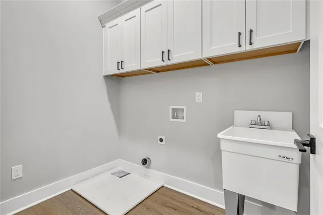a bathroom with a sink and cabinets