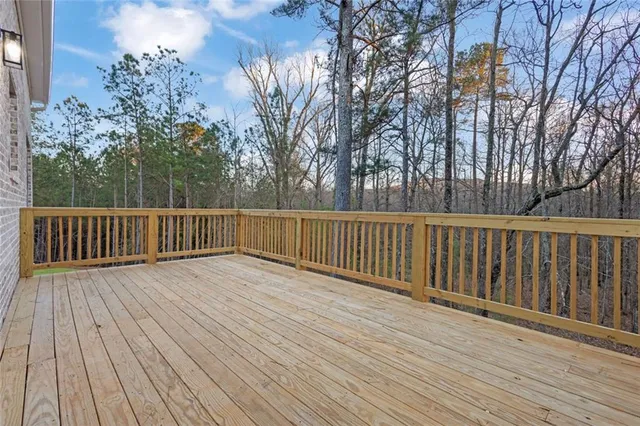 a view of deck with wooden floor and fence