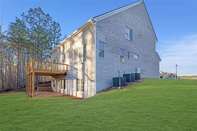 a view of an house with backyard porch and furniture