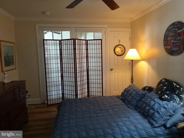 a bedroom with a bed and a closet