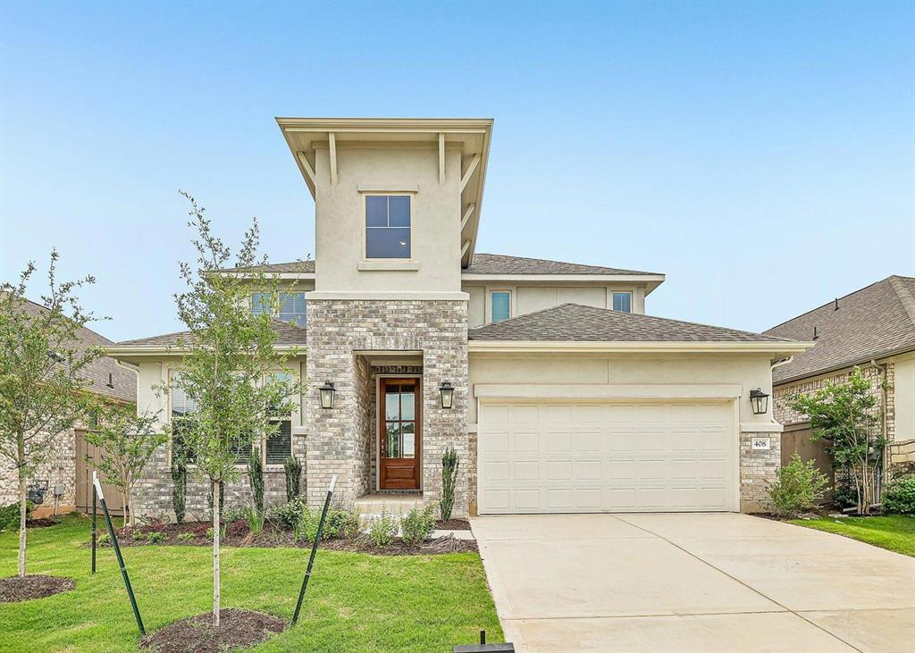 Natural stone and smooth stucco accents define this contemporary two-story home facade.