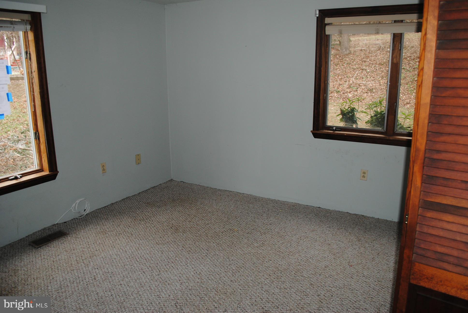 2614 Garrett Road White Hall, MD 21161 - Photo 14 of 27 an empty room with windows