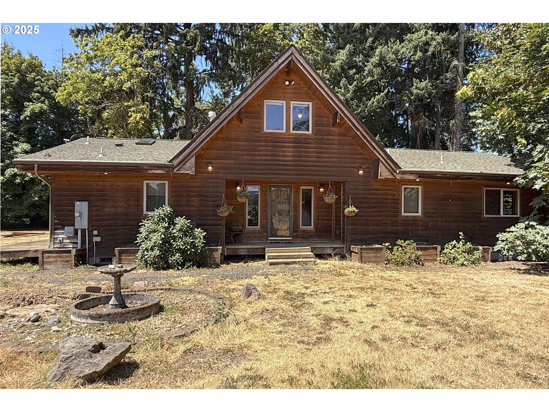 8325 Northeast Dog Ridge Road Newberg, OR 97132 - Photo 1 of 41 a front view of a house with a yard