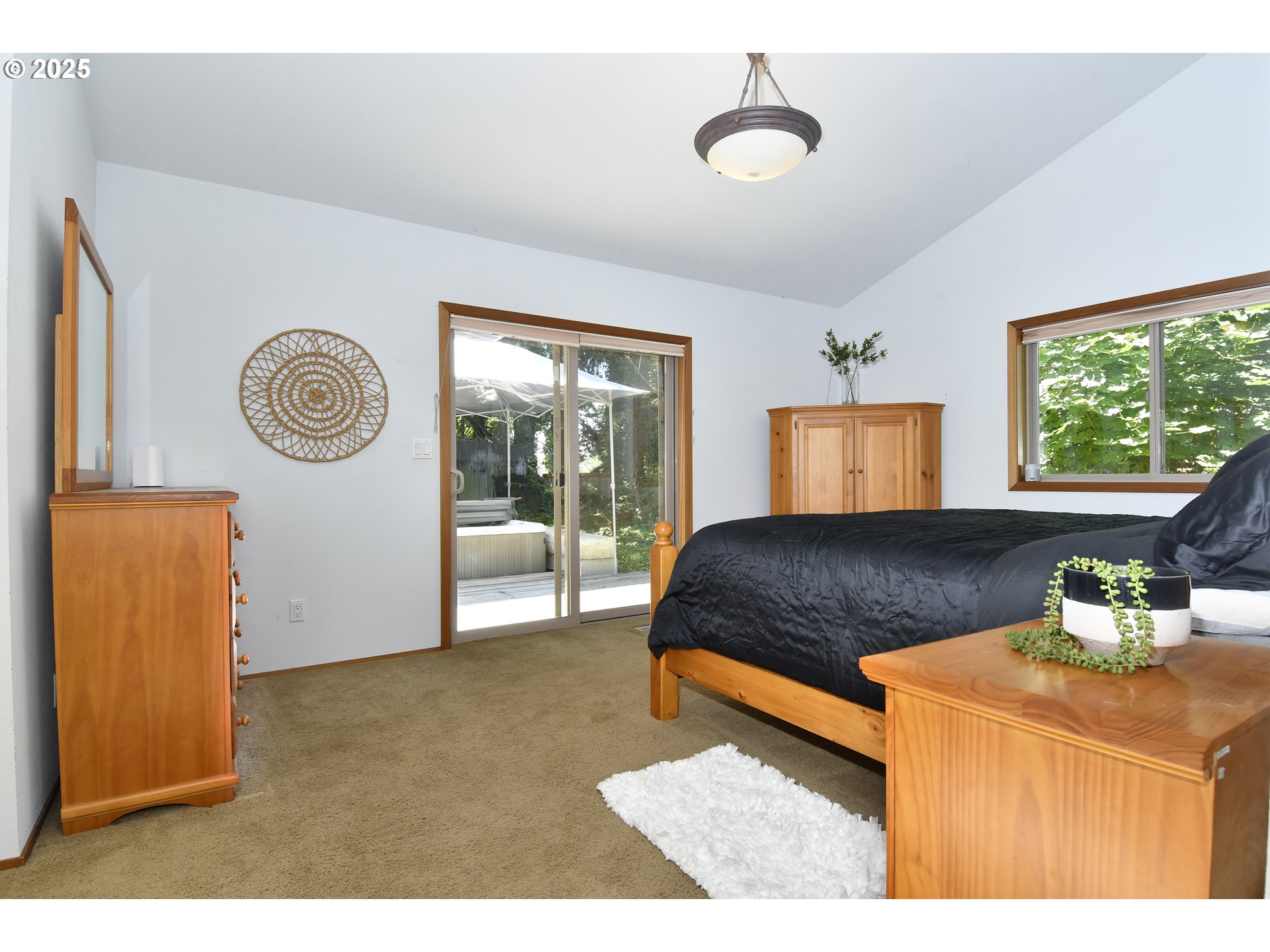 8325 Northeast Dog Ridge Road Newberg, OR 97132 - Photo 20 of 41 a bedroom with a large bed and a window