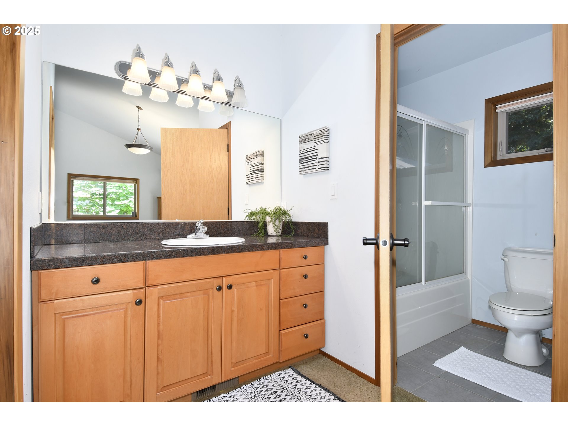 8325 Northeast Dog Ridge Road Newberg, OR 97132 - Photo 22 of 41 a bathroom with a sink vanity granite and toilet