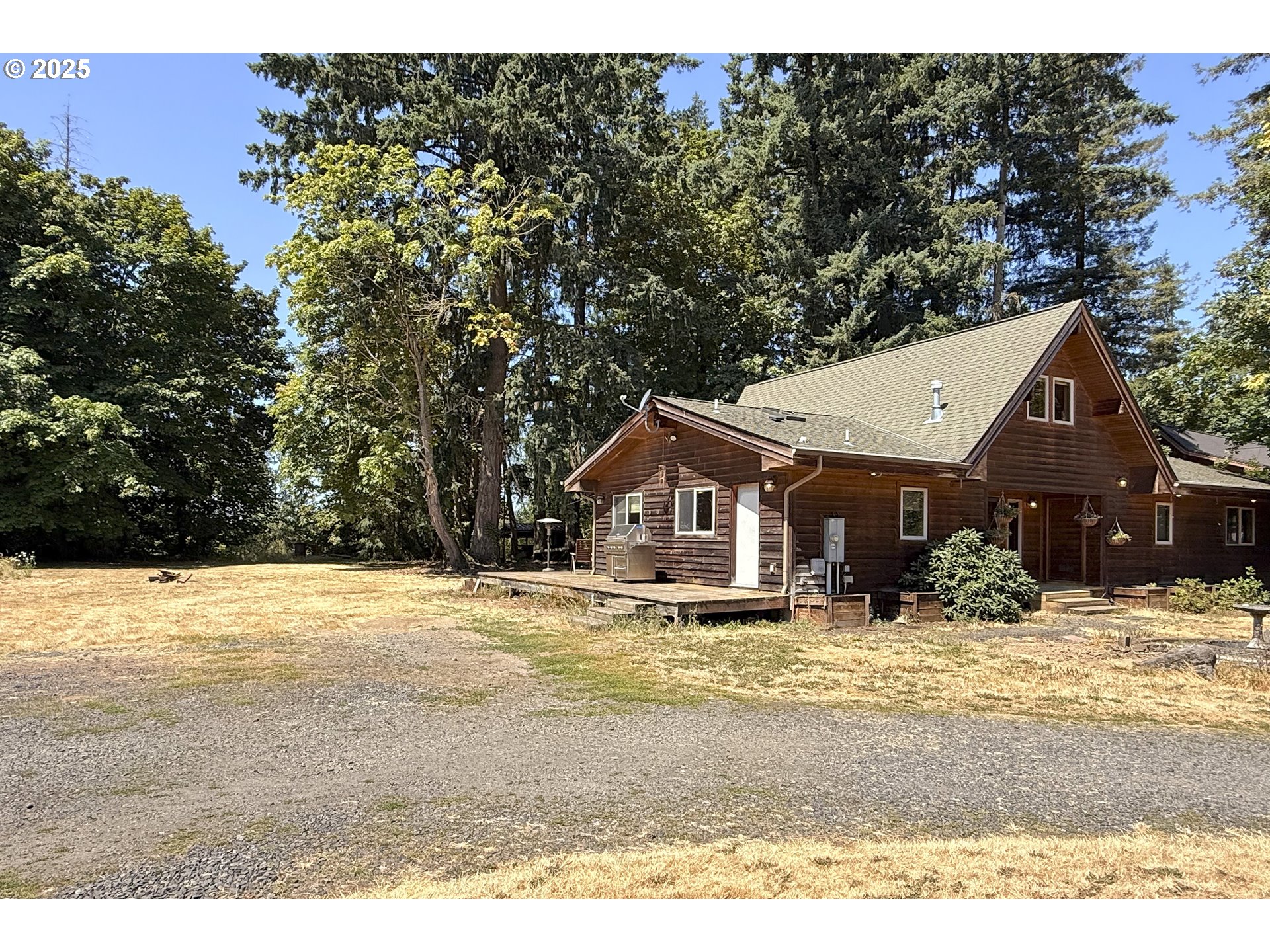 8325 Northeast Dog Ridge Road Newberg, OR 97132 - Photo 30 of 41 a view of a house with a yard covered in snow