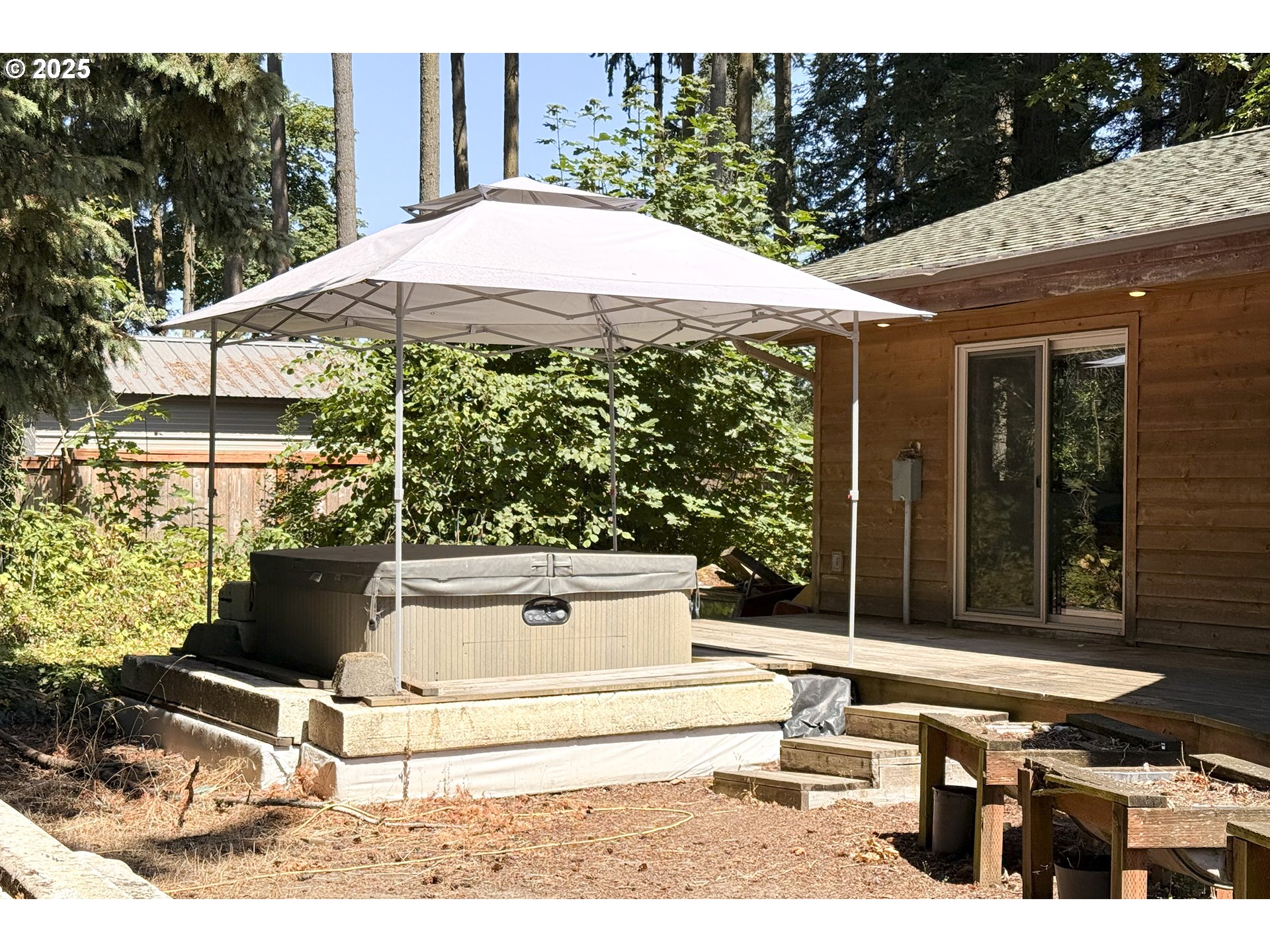 8325 Northeast Dog Ridge Road Newberg, OR 97132 - Photo 34 of 41 a view of a patio with table and chairs under an umbrella