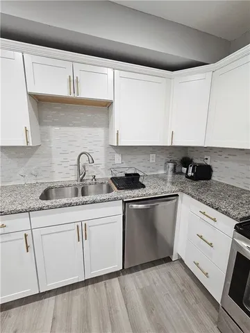 a kitchen with a refrigerator stove and microwave