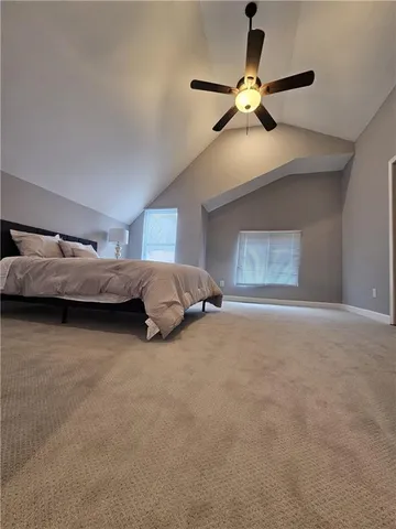 a large white bed in a white room