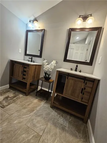 a bathroom with a shower and a toilet