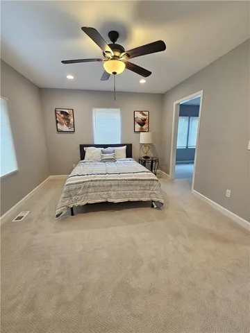 a view of a balcony with wooden floor and fence